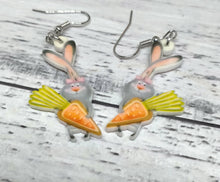 Load image into Gallery viewer, a pair of earrings with a rabbit holding a carrot
