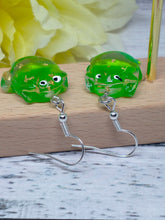 Load image into Gallery viewer, Novelty resin with gold foil flakes frog earrings
